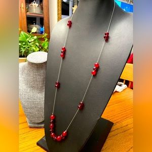 40” (very long) red glass beads necklace.